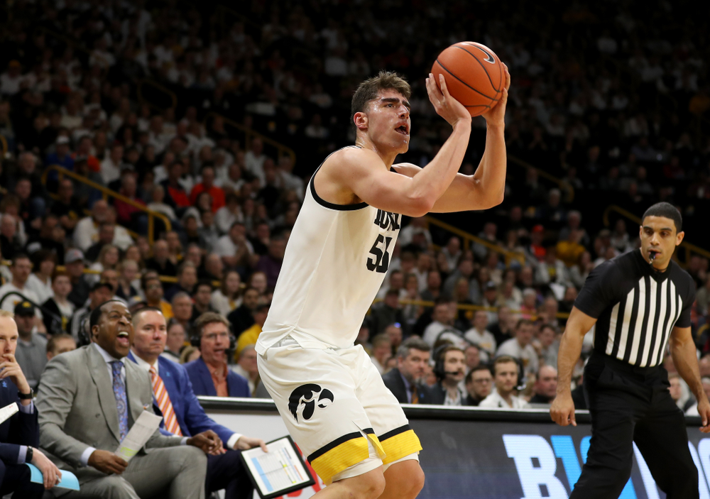 Iowa Hawkeyes forward Luka Garza (55) makes a three point basket against the Illinois Fighting Illini Sunday, February 2, 2020 at Carver-Hawkeye Arena. (Brian Ray/hawkeyesports.com)