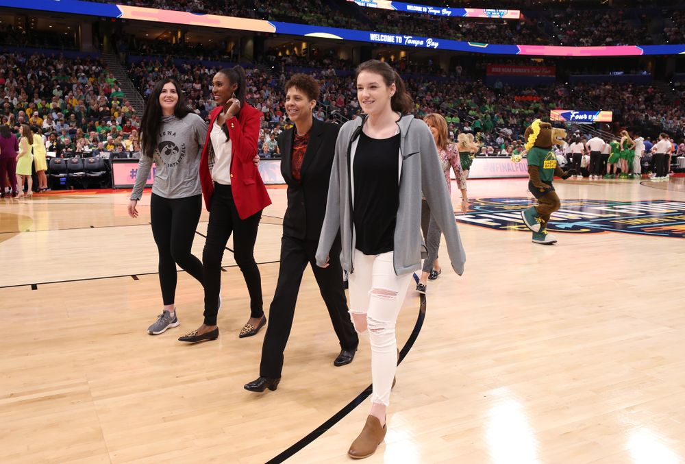 Iowa Hawkeyes forward Megan Gustafson (10) and Iowa State's Bridget Carleton are introduced with Naismith Starting 5 namesakes during a timeout in the second half of the National Semi-Final between Baylor and Oregon Friday, April 5, 2019 at Amalie Arena in Tampa, FL. (Brian Ray/hawkeyesports.com)