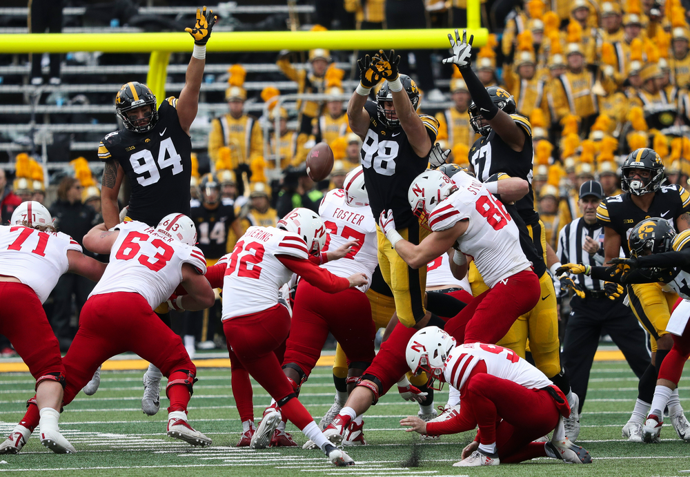 Iowa Hawkeyes defensive end A.J. Epenesa (94), Iowa Hawkeyes defensive end Anthony Nelson (98) and Iowa Hawkeyes defensive end Chauncey Golston (57) try to block a field goal at the end of the first half during a game against Nebraska at Kinnick Stadium on November 23, 2018. (Tork Mason/hawkeyesports.com)
