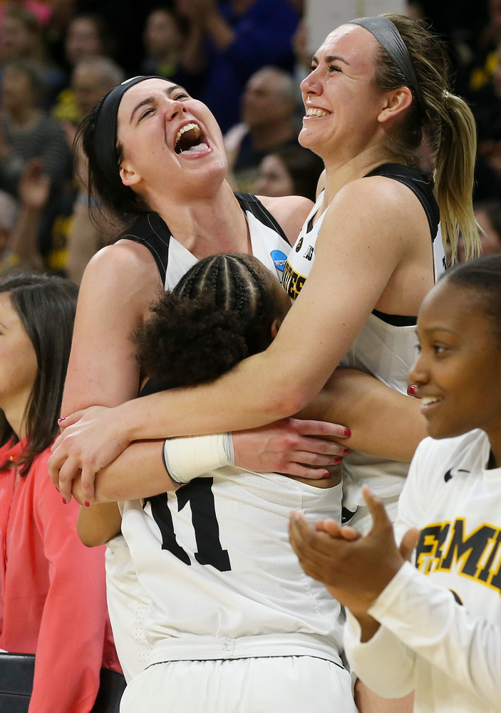 Iowa Hawkeyes guard Tania Davis (11), center Megan Gustafson (10), and forward Hannah Stewart (21) celebrate after winning their second round game in the 2019 NCAA Women's Basketball Tournament at Carver Hawkeye Arena in Iowa City on Sunday, Mar. 24, 2019. (Stephen Mally for hawkeyesports.com)