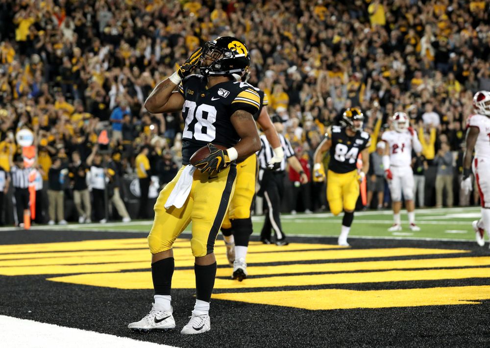 Iowa Hawkeyes running back Toren Young (28) celebrates a touchdown against the Miami RedHawks Saturday, August 31, 2019 at Kinnick Stadium in Iowa City. (Brian Ray/hawkeyesports.com)
