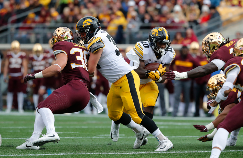 Iowa Hawkeyes fullback Brady Ross (36) blocks for running back Mekhi Sargent (10) against the Minnesota Golden Gophers Saturday, October 6, 2018 at TCF Bank Stadium. (Brian Ray/hawkeyesports.com)