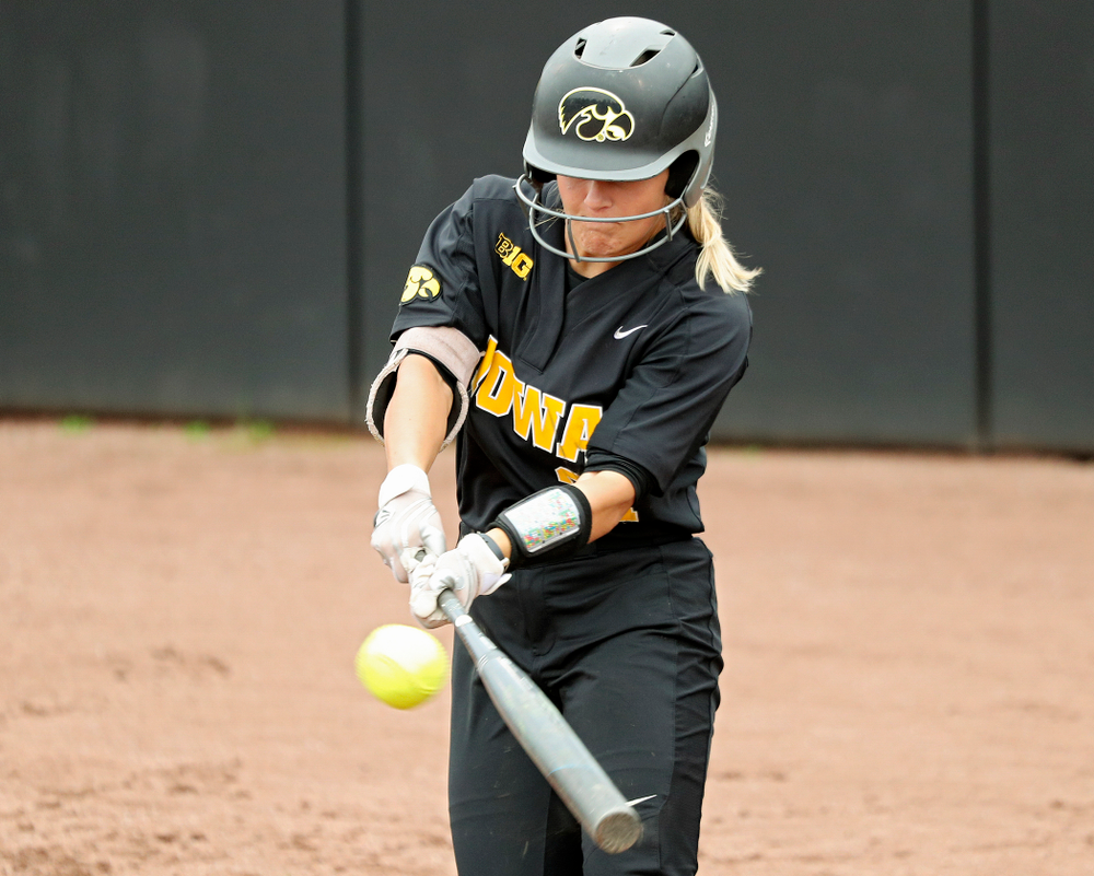 Iowa outfielder Havyn Monteer (21) drives a pitch for a hit during the fourth inning of their game against Iowa Softball vs Indian Hills Community College at Pearl Field in Iowa City on Sunday, Oct 6, 2019. (Stephen Mally/hawkeyesports.com)