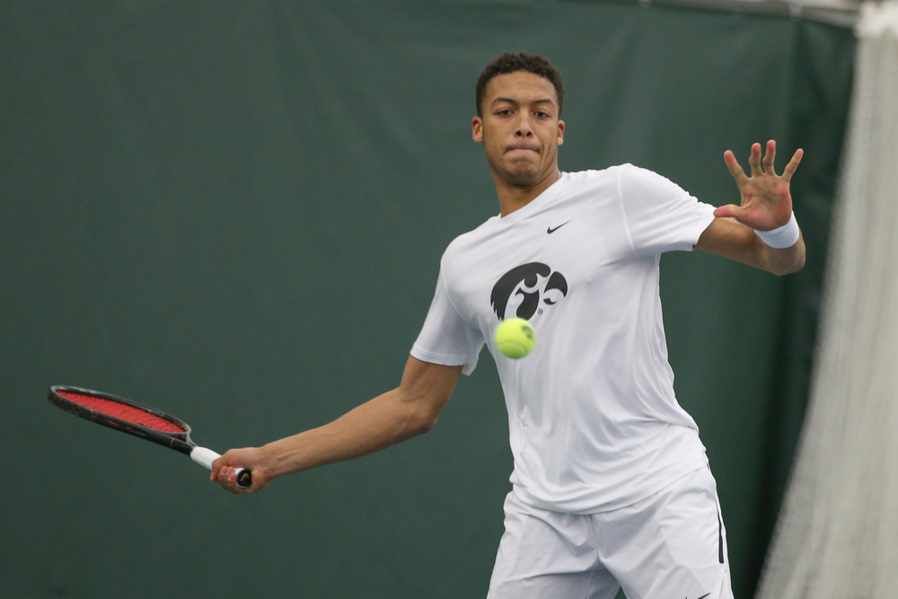 Iowa’s Oliver Okonkwo returns a hit during the Iowa men’s tennis meet vs Nebraska on Sunday, March 1, 2020 at the Hawkeye Tennis and Recreation Complex. (Lily Smith/hawkeyesports.com)