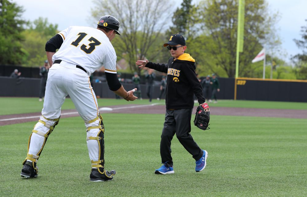 Garret Nichols throws out a first pitch before the Iowa Hawkeyes game against Michigan State Sunday, May 12, 2019 at Duane Banks Field. (Brian Ray/hawkeyesports.com)