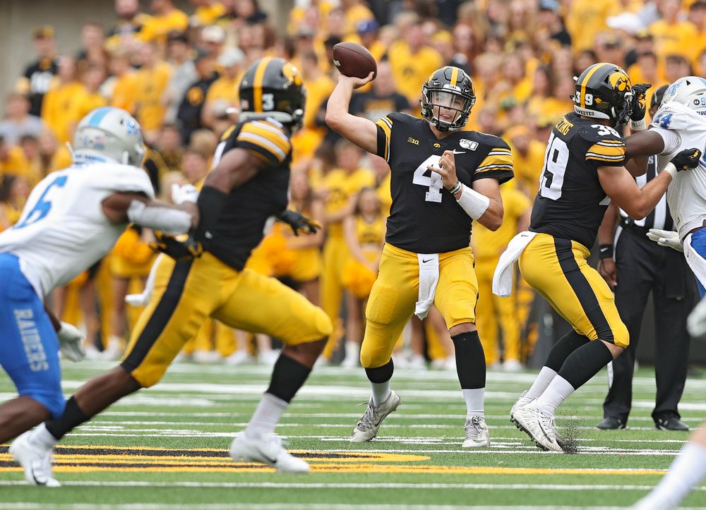 Iowa Hawkeyes quarterback Nate Stanley (4) throws a pass to wide receiver Tyrone Tracy Jr. (3) during third quarter of their game at Kinnick Stadium in Iowa City on Saturday, Sep 28, 2019. (Stephen Mally/hawkeyesports.com)
