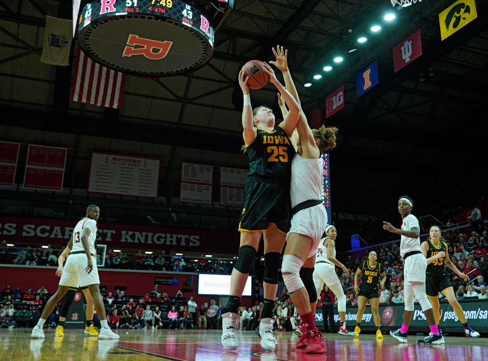 Iowa forward/center Monika Czinano (25) scores a basket during the fourth quarter of their game at the Rutgers Athletic Center in Piscataway, N.J. on Sunday, March 1, 2020. (Stephen Mally/hawkeyesports.com)