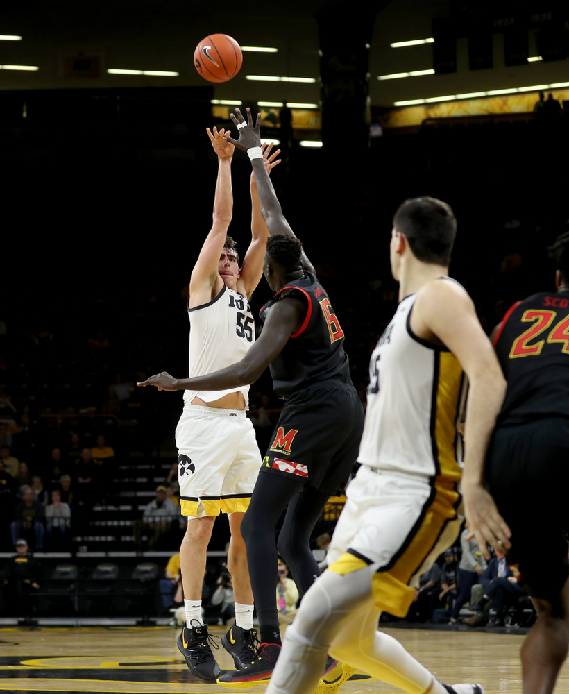 Iowa Hawkeyes forward Luka Garza (55) knocks down a three point basket against the Maryland Terrapins Friday, January 10, 2020 at Carver-Hawkeye Arena. (Brian Ray/hawkeyesports.com)