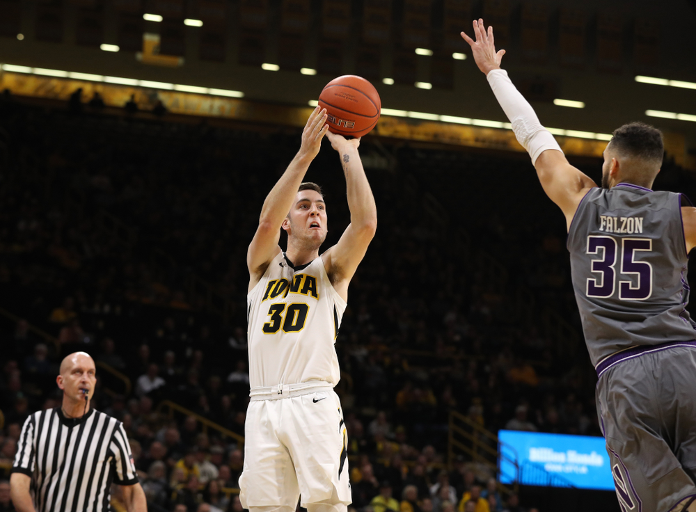 Iowa Hawkeyes guard Connor McCaffery (30) knocks down a three point basket against the Northwestern Wildcats Sunday, February 10, 2019 at Carver-Hawkeye Arena. (Brian Ray/hawkeyesports.com)