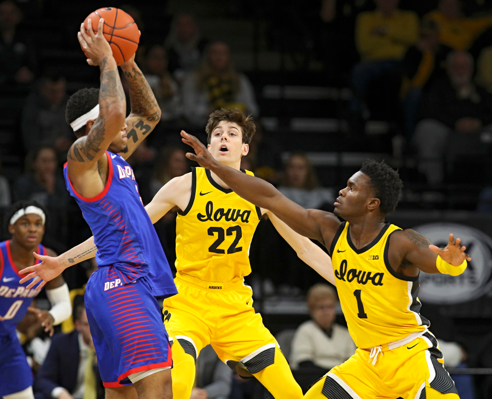 Iowa Hawkeyes forward Patrick McCaffery (22) and guard Joe Toussaint (1) apply pressure during the first half of their game at Carver-Hawkeye Arena in Iowa City on Monday, Nov 11, 2019. (Stephen Mally/hawkeyesports.com)