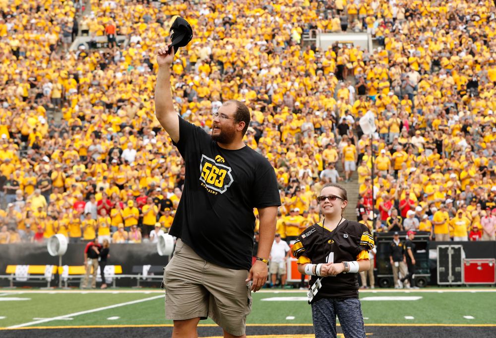 Honorary Captain Julian Vandervelde and the kid captain against the Northern Illinois Huskies Saturday, September 1, 2018 at Kinnick Stadium. (Brian Ray/hawkeyesports.com)