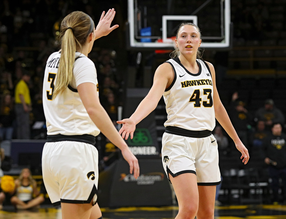 Iowa Hawkeyes guard Makenzie Meyer (3) celebrates with forward Amanda Ollinger (43) in the closing seconds of the fourth quarter of the game at Carver-Hawkeye Arena in Iowa City on Thursday, February 6, 2020. (Stephen Mally/hawkeyesports.com)