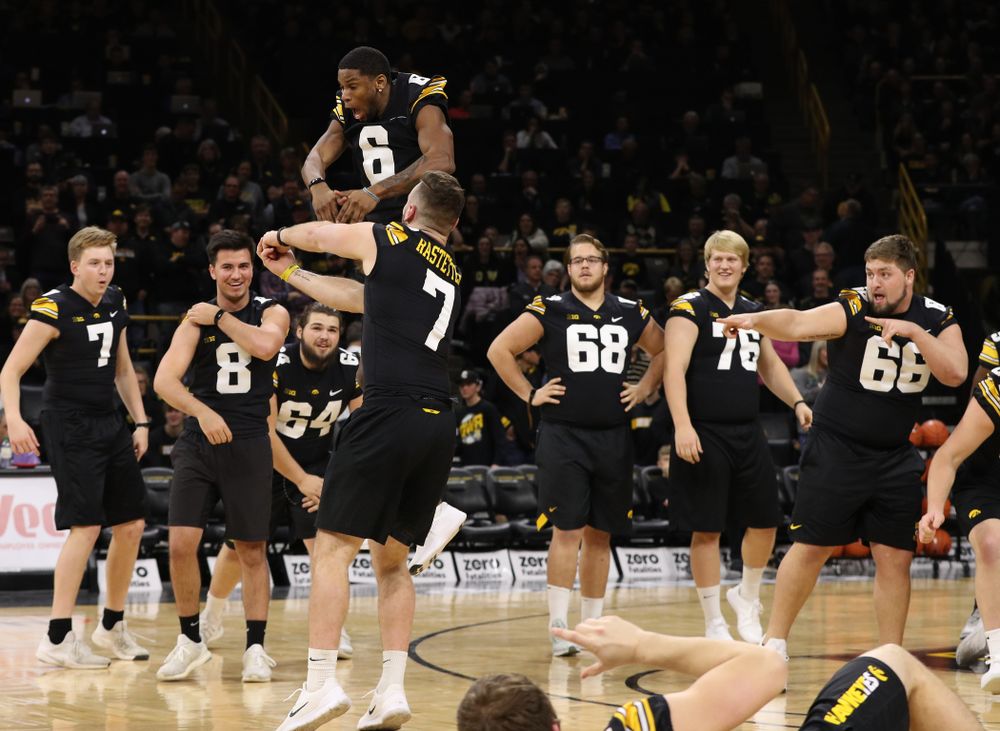 The Iowa Dance Team performs with the Iowa Football Team at halftime of the Iowa Hawkeyes game against the Indiana Hoosiers Friday, February 22, 2019 at Carver-Hawkeye Arena. (Brian Ray/hawkeyesports.com)