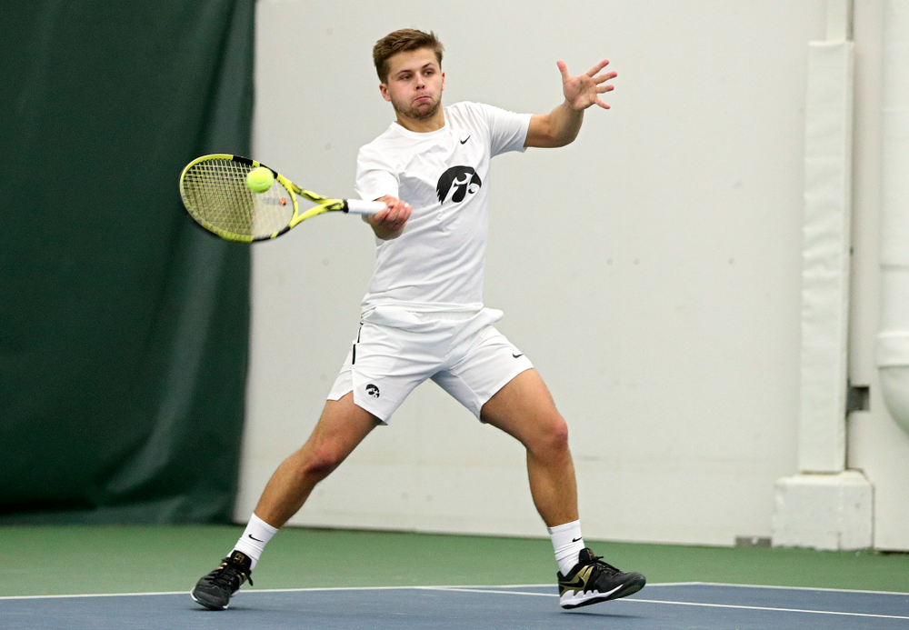 Iowa’s Will Davies returns a shot during his singles match at the Hawkeye Tennis and Recreation Complex in Iowa City on Sunday, February 16, 2020. (Stephen Mally/hawkeyesports.com)