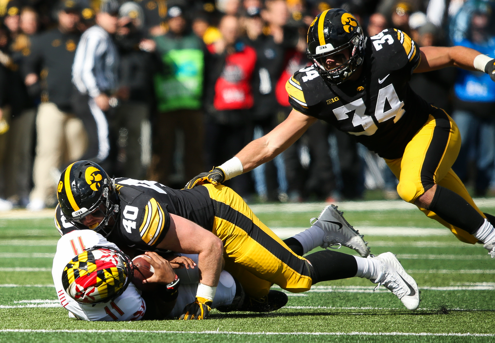 Iowa Hawkeyes defensive end Parker Hesse (40) sacks the quarterback during a game against Maryland at Kinnick Stadium on October 20, 2018. (Tork Mason/hawkeyesports.com)