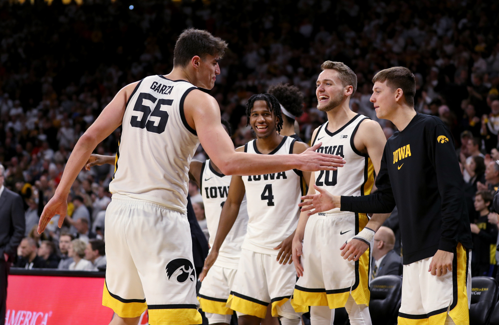 Iowa Hawkeyes forward Luka Garza (55) and guard Austin Ash (13) against the Illinois Fighting Illini Sunday, February 2, 2020 at Carver-Hawkeye Arena. (Brian Ray/hawkeyesports.com)