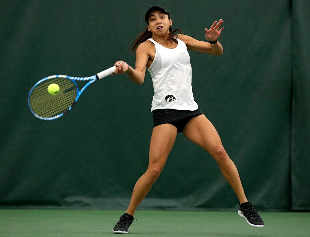 Iowa’s Michelle Bacalla returns a shot during her doubles match at the Hawkeye Tennis and Recreation Complex in Iowa City on Sunday, February 23, 2020. (Stephen Mally/hawkeyesports.com)