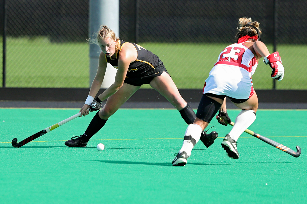 Iowa’s Lokke Stribos (14) scores a goal during the first quarter of their match at Grant Field in Iowa City on Friday, Oct 4, 2019. (Stephen Mally/hawkeyesports.com)