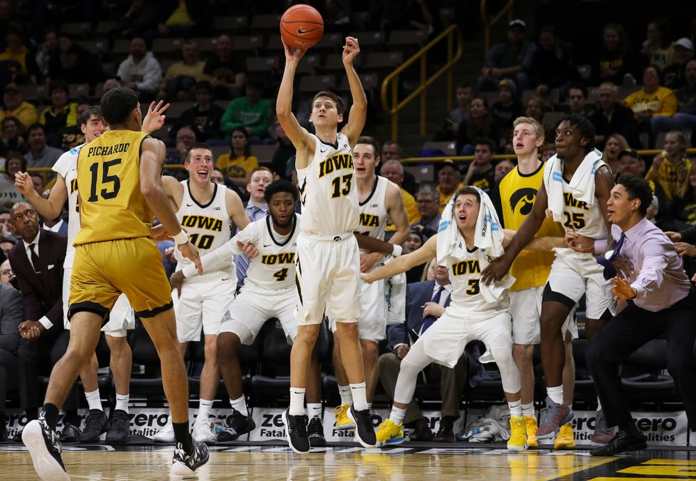 Iowa Hawkeyes guard Austin Ash (13) shoots a 3-pointer during a game against Alabama State at Carver-Hawkeye Arena on November 21, 2018. (Tork Mason/hawkeyesports.com)
