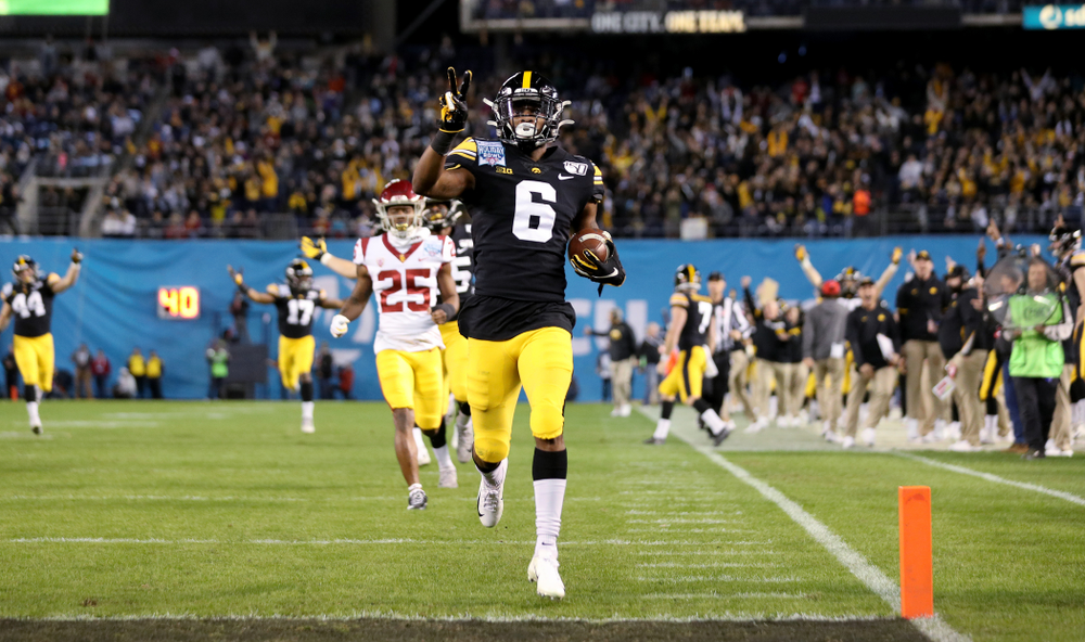 Iowa Hawkeyes wide receiver Ihmir Smith-Marsette (6) returns a kick for a touchdown against USC in the Holiday Bowl Friday, December 27, 2019 at San Diego Community Credit Union Stadium. (Brian Ray/hawkeyesports.com)