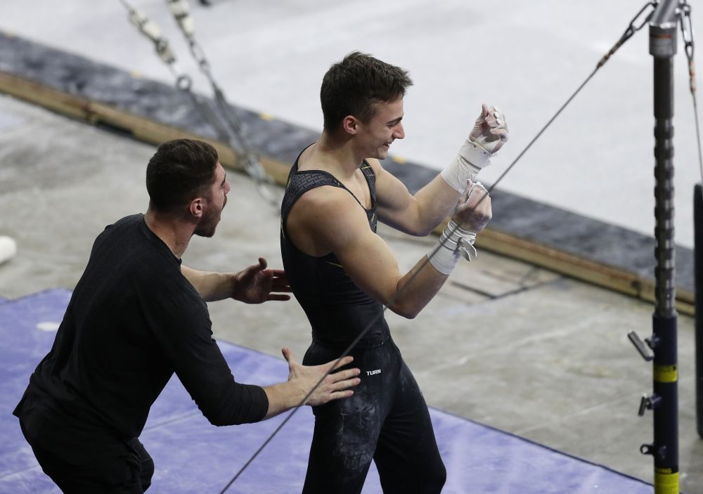Iowa's Mitch Mandozzi competes on the high bar against Oklahoma Saturday, February 9, 2019 at Carver-Hawkeye Arena. (Brian Ray/hawkeyesports.com)