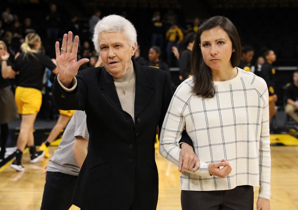 Former University of Iowa Director of Intercollegiate Athletics for Women Dr. Christine Grant receives her trophy for being inducted into the WomenÕs Basketball Hall of Fame from Iowa Hawkeyes head coach Lisa Bluder and director of basketball operations Kathryn Reynolds
before their game against the Robert Morris Colonials Sunday, December 2, 2018 at Carver-Hawkeye Arena. (Photo by Brian Ray)