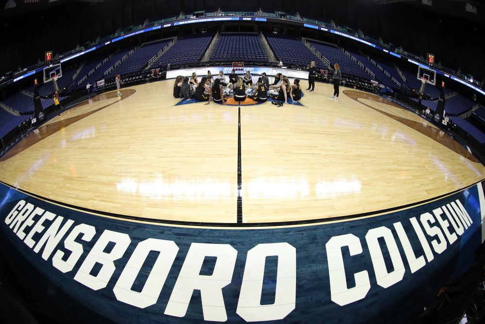 The Iowa Hawkeyes talk in their circle during shoot around before their regional final against the Baylor Lady Bears in the 2019 NCAA Women's College Basketball Tournament Monday, April 1, 2019 at Greensboro Coliseum in Greensboro, NC.(Brian Ray/hawkeyesports.com)