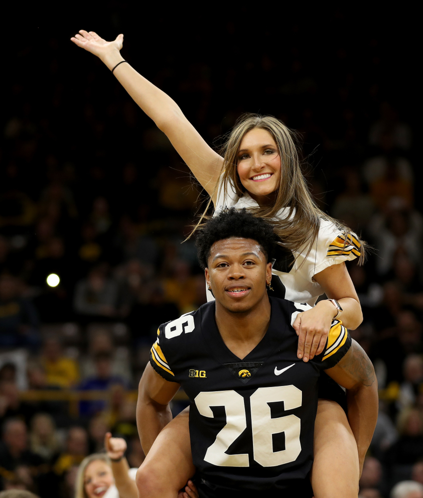 Members of the Hawkeye Football team performs with the Iowa Dance Team at halftime of the Iowa Hawkeyes game against the Ohio State Buckeyes Thursday, February 20, 2020 at Carver-Hawkeye Arena. (Brian Ray/hawkeyesports.com)