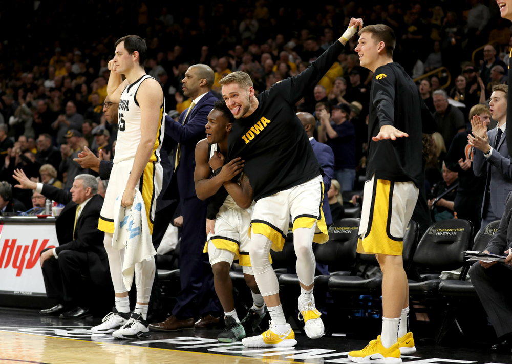 Iowa Hawkeyes forward Riley Till (20), guard Joe Toussaint (1), and guard Austin Ash (13) against the Ohio State Buckeyes Thursday, February 20, 2020 at Carver-Hawkeye Arena. (Brian Ray/hawkeyesports.com)