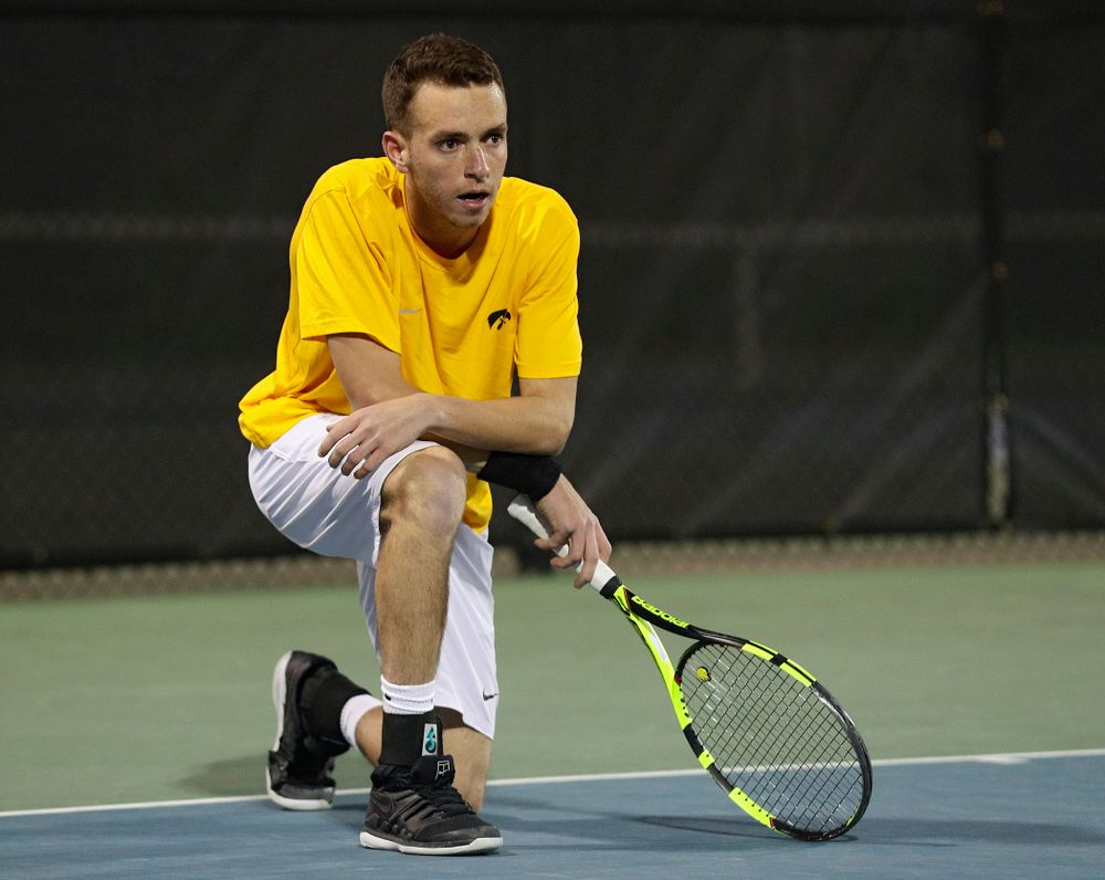 Iowa's Kareem Allaf drops to a knee after winning his match again Michigan State at the Hawkeye Tennis and Recreation Complex in Iowa City on Friday, Apr. 19, 2019. (Stephen Mally/hawkeyesports.com)
