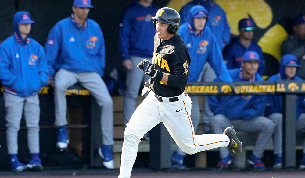 Iowa shortstop Dylan Nedved (17) runs home to score a run during the third inning of their college baseball game at Duane Banks Field in Iowa City on Tuesday, March 10, 2020. (Stephen Mally/hawkeyesports.com)
