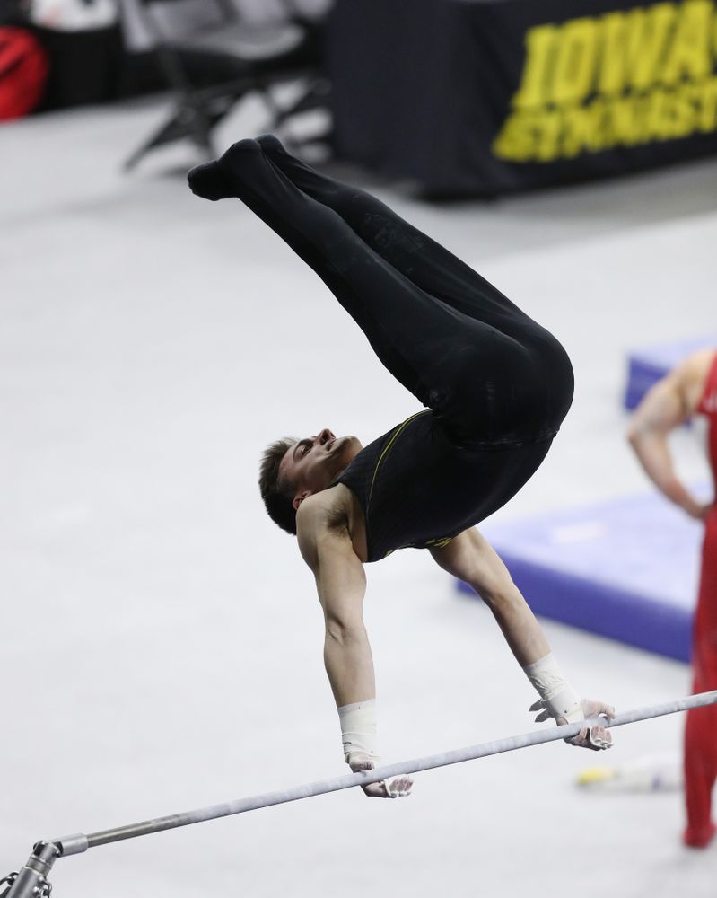 Iowa's Mitch Mandozzi competes on the high bar against Oklahoma Saturday, February 9, 2019 at Carver-Hawkeye Arena. (Brian Ray/hawkeyesports.com)