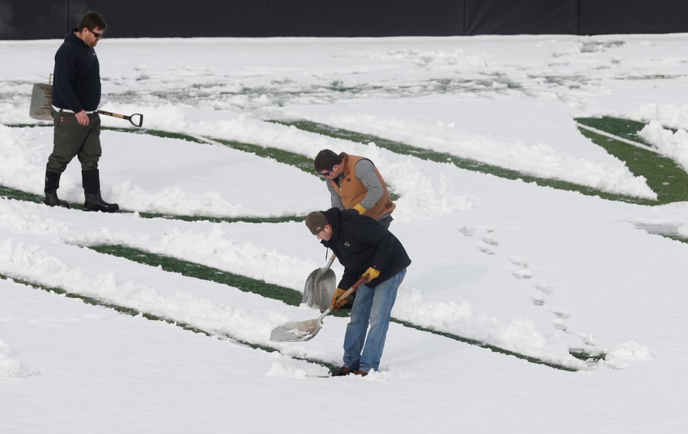 Members of the Iowa Athletics Turf Management staff create the #SnowWave for kids in the Stead Family Children's Hospital Thursday, February