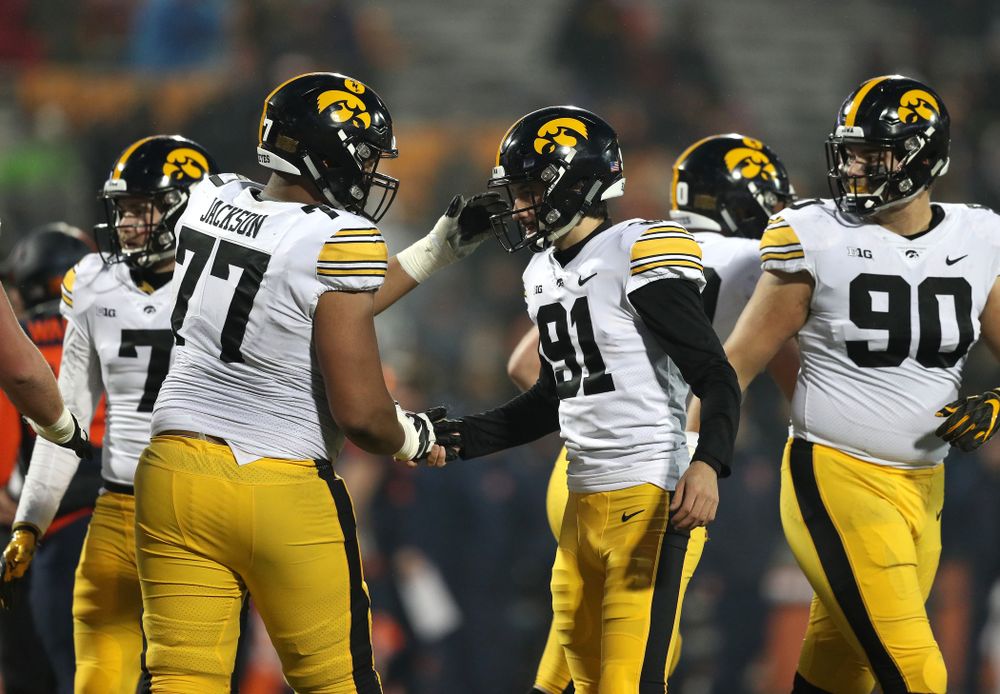 Iowa Hawkeyes place kicker Miguel Recinos (91) and offensive lineman Alaric Jackson (77) against the Illinois Fighting Illini Saturday, November 17, 2018 at Memorial Stadium in Champaign, Ill. (Brian Ray/hawkeyesports.com)