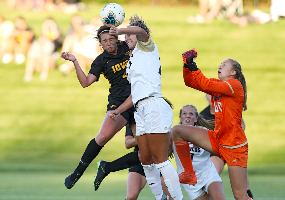 Iowa forward Kaleigh Haus (4) scores a goal with a header during the first half of their match against Western Michigan at the Iowa Soccer Complex in Iowa City on Thursday, Aug 22, 2019. (Stephen Mally/hawkeyesports.com)
