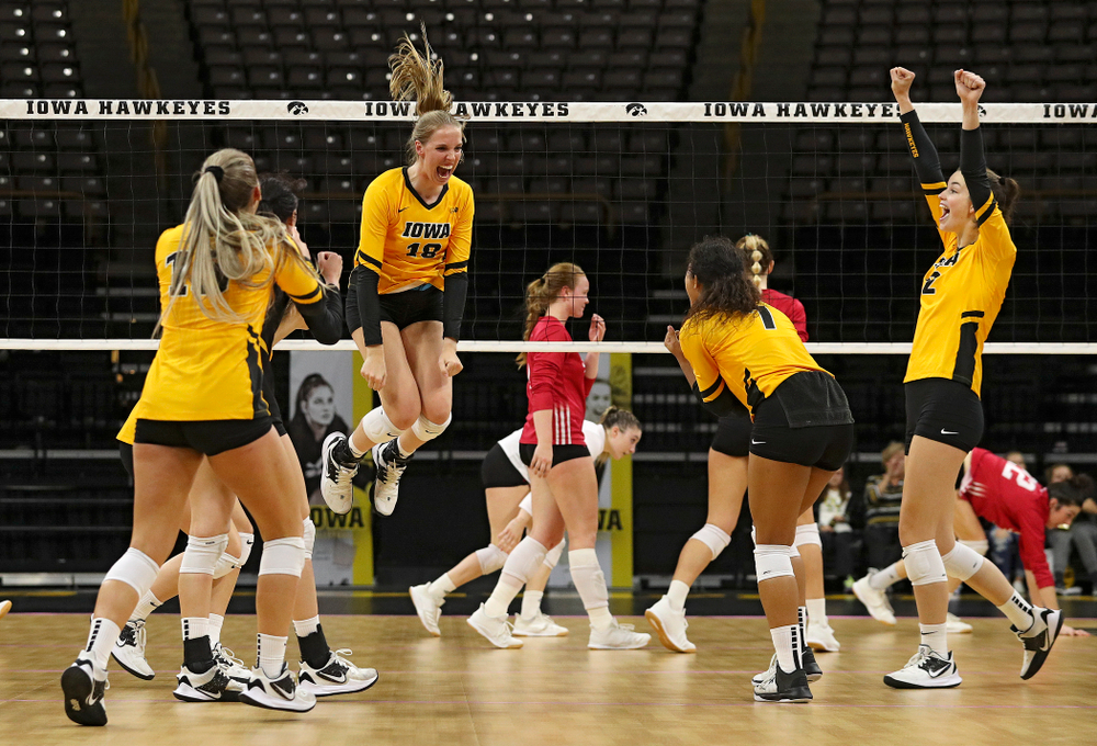 Iowa’s Hannah Clayton (18) celebrates a score during their match at Carver-Hawkeye Arena in Iowa City on Sunday, Oct 20, 2019. (Stephen Mally/hawkeyesports.com)