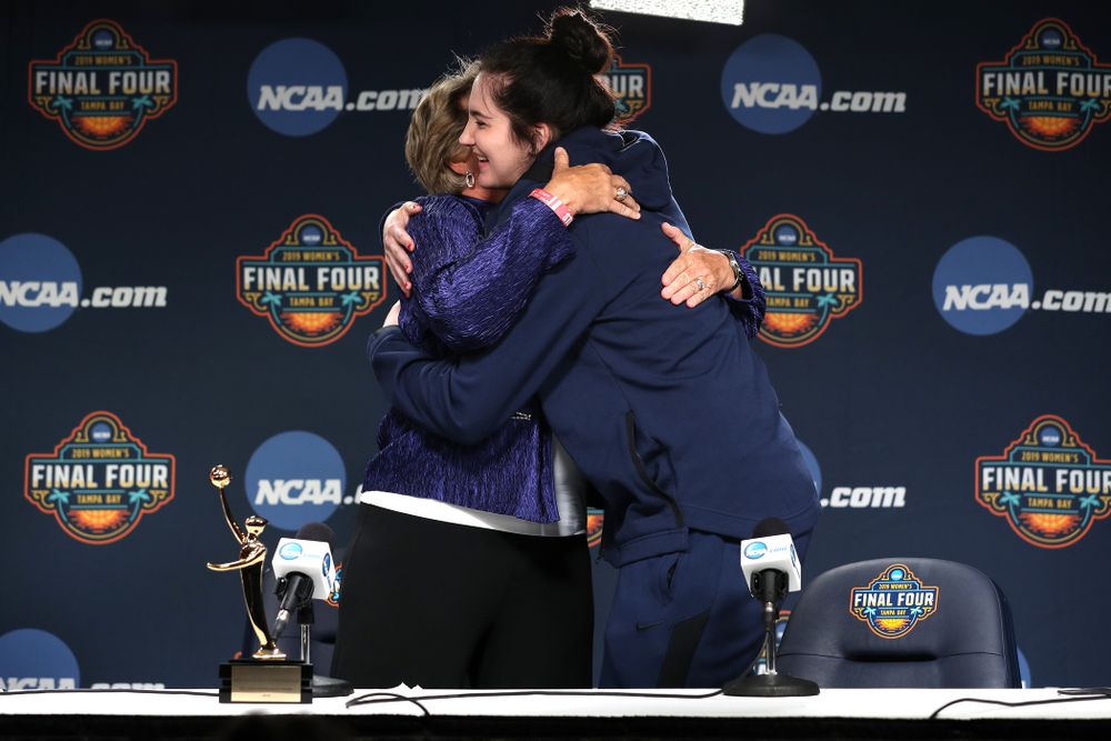 Iowa Hawkeyes forward Megan Gustafson (10) receives US Basketball Writers Association Ann Meyers Drysdale Player of the Year award from Ann Meyers Drysdale during a news conference Friday, April 5, 2019 at Amalie Arena in Tampa, FL. (Brian Ray/hawkeyesports.com)