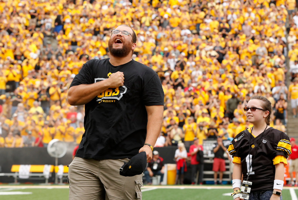 Honorary Captain Julian Vandervelde and the kid captain against the Northern Illinois Huskies Saturday, September 1, 2018 at Kinnick Stadium. (Brian Ray/hawkeyesports.com)