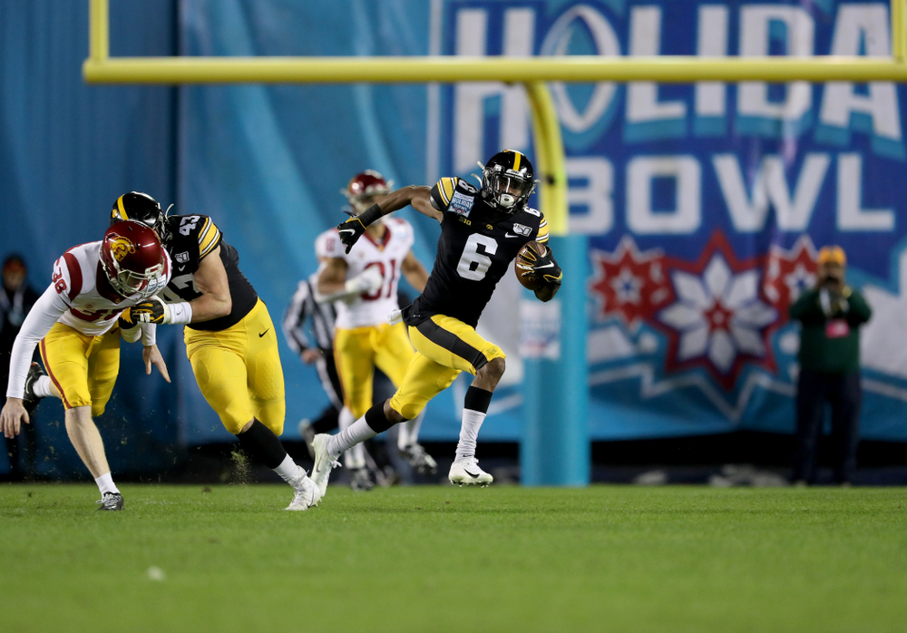 Iowa Hawkeyes wide receiver Ihmir Smith-Marsette (6) returns a kick for a touchdown against USC in the Holiday Bowl Friday, December 27, 2019 at San Diego Community Credit Union Stadium. (Brian Ray/hawkeyesports.com)