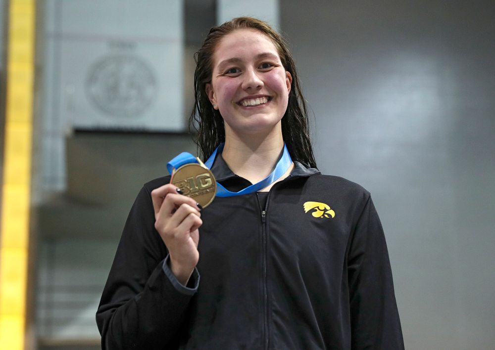 Iowa’s Hannah Burvill on the awards stand after placing third in the women’s 200 yard freestyle final event during the 2020 Women’s Big Ten Swimming and Diving Championships at the Campus Recreation and Wellness Center in Iowa City on Friday, February 21, 2020. (Stephen Mally/hawkeyesports.com)