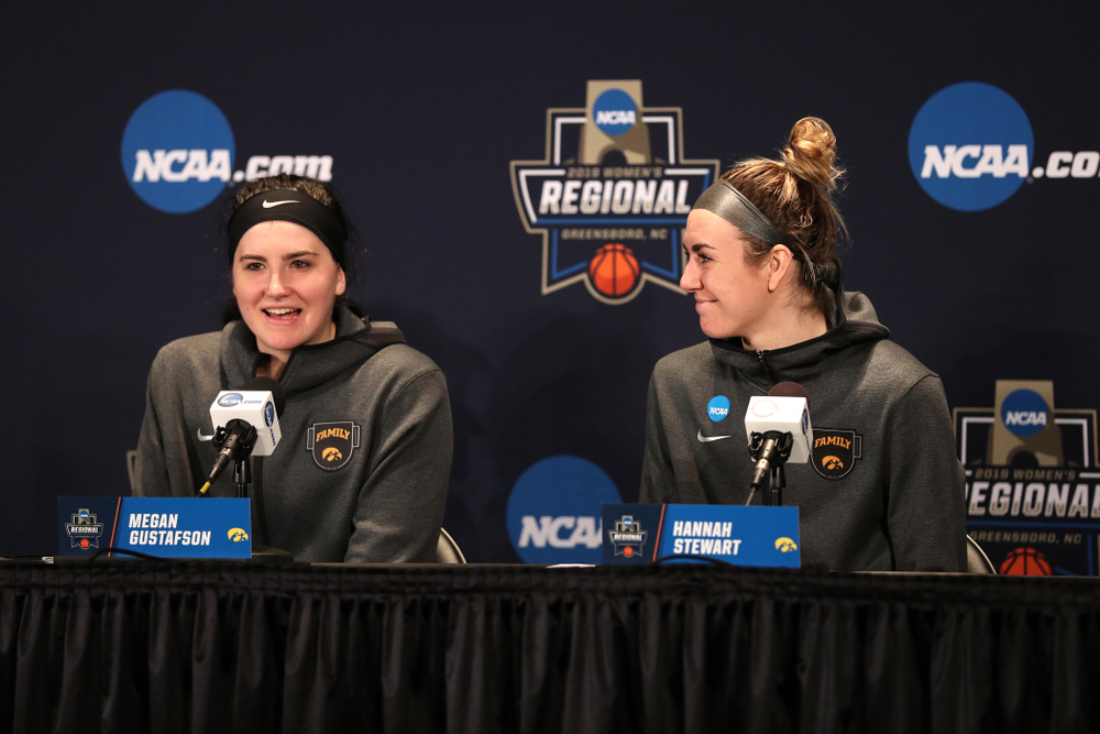 Iowa Hawkeyes forward Megan Gustafson (10) and forward Hannah Stewart (21) against the NC State Wolfpack in the regional semi-final of the 2019 NCAA Women's College Basketball Tournament Saturday, March 30, 2019 at Greensboro Coliseum in Greensboro, NC.(Brian Ray/hawkeyesports.com)