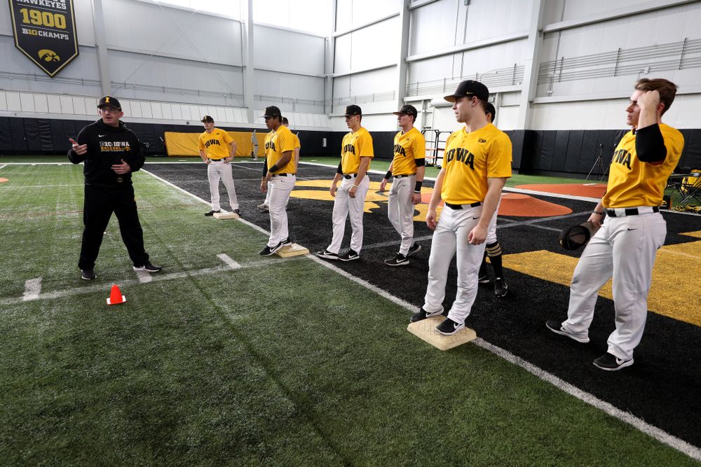 Iowa Hawkeyes assistant coach Marty Sutherland runs a base running drill during practice Thursday, February 6, 2020 at the Indoor Practice Facility. (Brian Ray/hawkeyesports.com)
