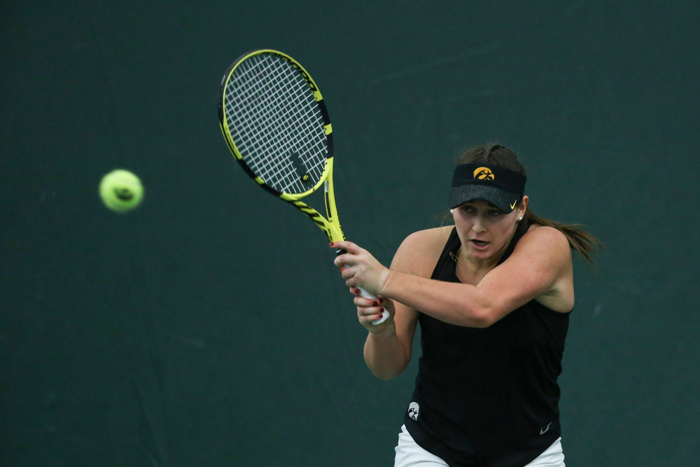 Iowa’s Danielle Bauers returns a hit during the Iowa women’s tennis meet vs DePaul on Friday, February 21, 2020 at the Hawkeye Tennis and Recreation Complex. (Lily Smith/hawkeyesports.com)
