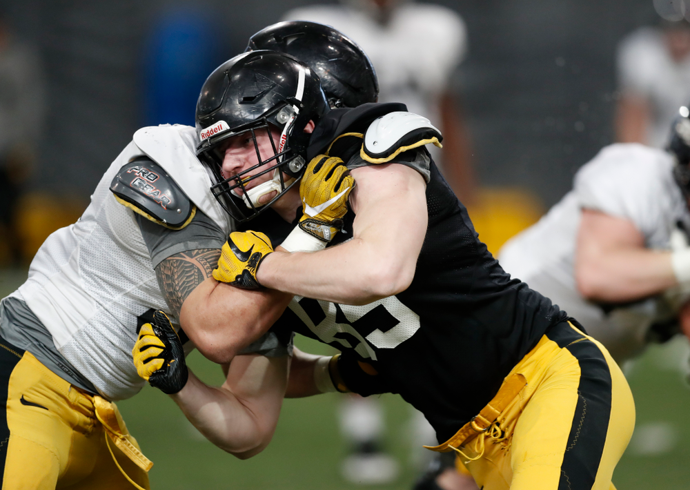 Iowa Hawkeyes tight end Nate Vejvoda (85) and defensive end A.J. Epenesa (94) during spring practice Wednesday, March 28, 2018 at the Hansen Football Performance Center. (Brian Ray/hawkeyesports.com)
