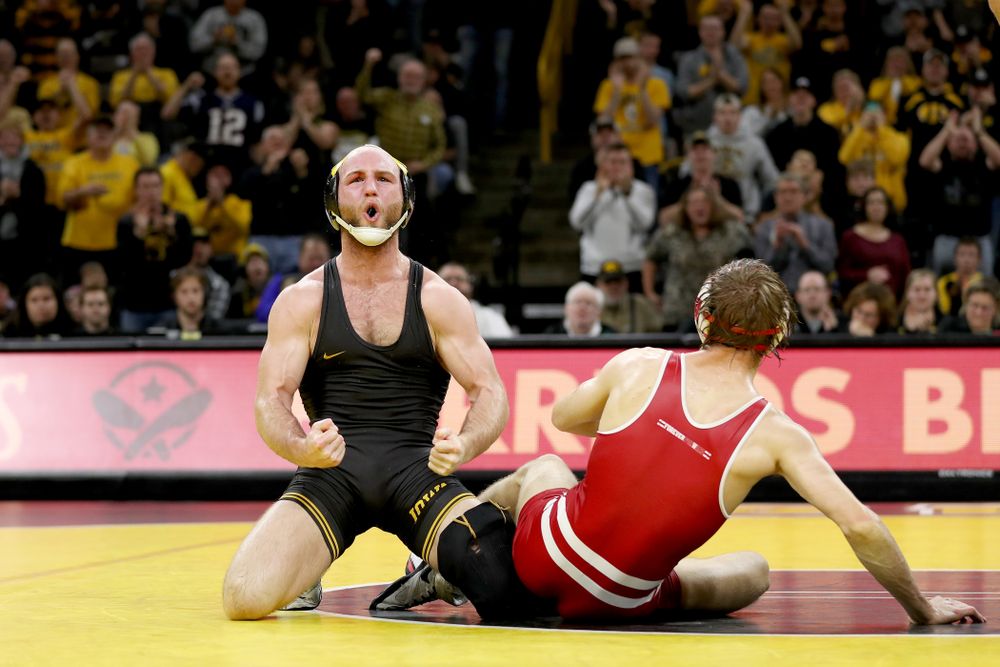 IowaÕs Alex Marinelli celebrates after defeating WisconsinÕs Evan Wick at 165 pounds Sunday, December 1, 2019 at Carver-Hawkeye Arena. Marinelli won the match 4-2. (Brian Ray/hawkeyesports.com)