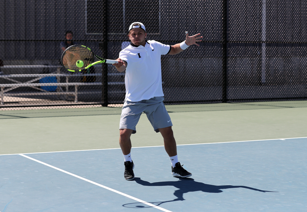 IowaÕs Oliver Okonkwo and Will Davies play a doubles match against the Michigan Wolverines Sunday, April 21, 2019 at the Hawkeye Tennis and Recreation Complex. (Brian Ray/hawkeyesports.com)
