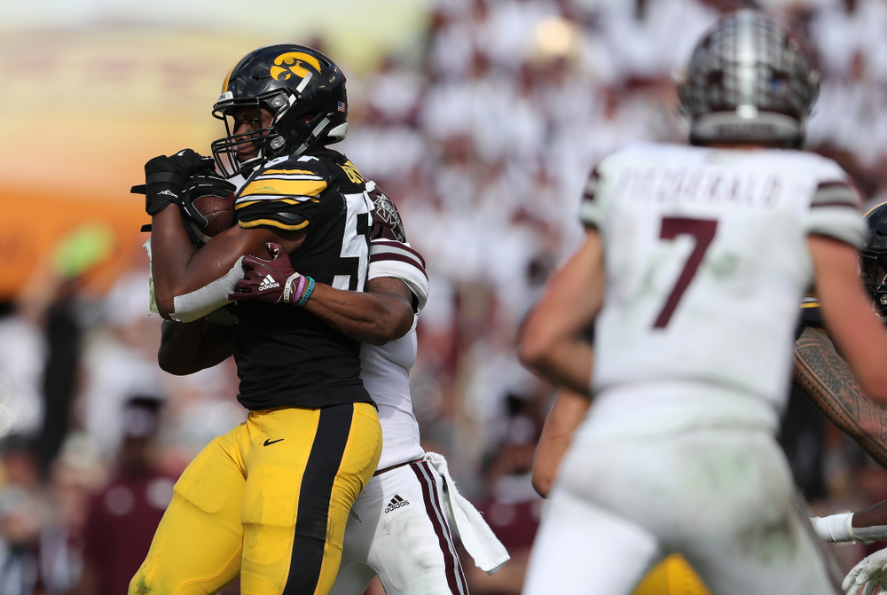 Iowa Hawkeyes defensive end Chauncey Golston (57) intercepts a pass during the Outback Bowl Tuesday, January 1, 2019 at Raymond James Stadium in Tampa, FL. (Brian Ray/hawkeyesports.com)