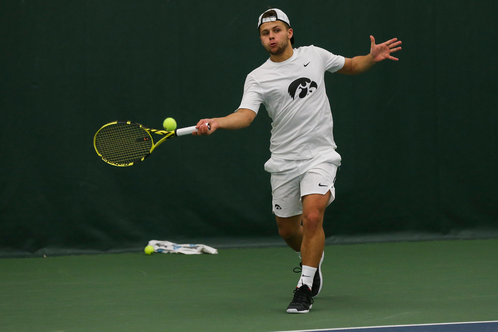 Iowa’s Will Davies hits a forehand during the Iowa men’s tennis match vs Western Michigan on Saturday, January 18, 2020 at the Hawkeye Tennis and Recreation Complex. (Lily Smith/hawkeyesports.com)