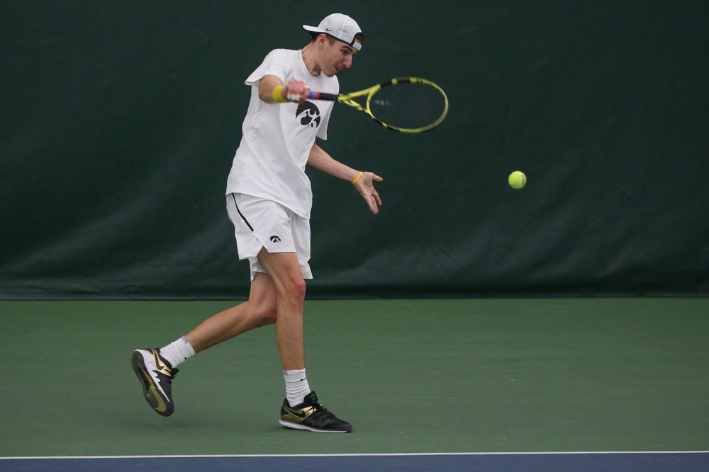 Iowa’s Nikita Snezhko returns a hit during the Iowa men’s tennis meet vs Nebraska on Sunday, March 1, 2020 at the Hawkeye Tennis and Recreation Complex. (Lily Smith/hawkeyesports.com)