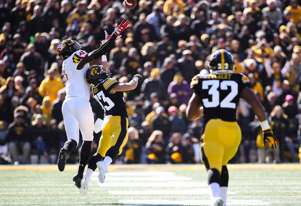 Iowa Hawkeyes defensive back Riley Moss (33) breaks up a pass during a game against Maryland at Kinnick Stadium on October 20, 2018. (Tork Mason/hawkeyesports.com)